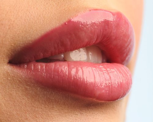 closeup-shot-stylist-applies-lipstick-to-the-lips-2024-11-26-23-11-11-utc